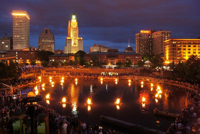 An early evening view of WaterFire at Waterplace Park in downtown Providence. There will be several lightings this summer. Providence Journal File Photo/Sandor Bodo