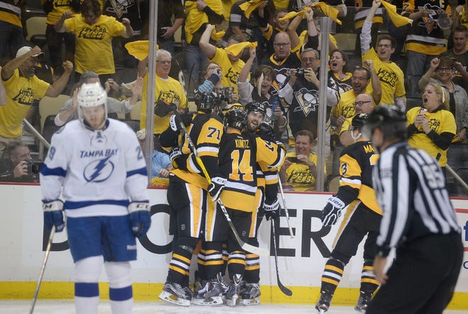 Evgeni Malkin (71), Chris Kunitz (14), Ben Lovejoy (12) and Bryan Rust (17) celebrate after Rust scored the first goal of the game during the second period of Game 7 of the Eastern Conference final Thursday at Consol Energy Center in Pittsburgh.