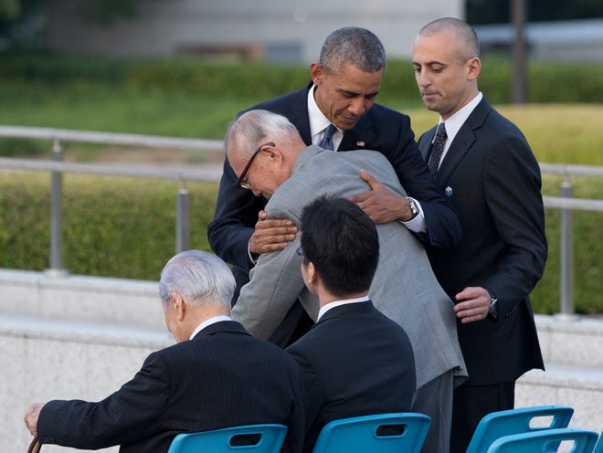 U.S. President Barack Obama hugs Shigeaki Mori, an atomic bomb survivor; creator of the memorial for American WWII POWs killed at Hiroshima, during a ceremony at Hiroshima Peace Memorial Park in Hiroshima, western Japan, Friday, May 27, 2016. Obama on Friday became the first sitting U.S. president to visit the site of the world's first atomic bomb attack, bringing global attention both to survivors and to his unfulfilled vision of a world without nuclear weapons.
