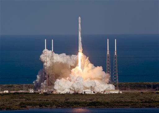 In this image released by SpaceX, an unmanned Falcon rocket lifts off from from Cape Canaveral Air Force Station, Friday, May 27, 2016, in Cape Canaveral, Fla. The first stage of the unmanned Falcon rocket settled onto a barge 400 miles off the Florida coast, eight minutes after liftoff, It's the third successful booster landing at sea for the California-based SpaceX. This one came after the rocket launched an Asian communications satellite. (SpaceX via AP)