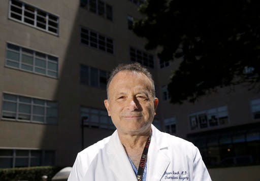 Dr. Peter Stock poses for photos on the University of California, San Francisco Medical Center campus in San Francisco, Friday, May 27, 2016. California lawmakers approved emergency legislation Friday to allow a man with HIV to receive part of his HIV-positive husband's liver before the surgery becomes too dangerous, possibly within weeks. The UCSF Medical Center is one of four U.S. hospitals authorized to transplant HIV-infected organs. Transplant surgeon Dr. Stock says he hopes to perform the operation quickly, but he will need time to do tests and preparation on the patients. (AP Photo/Jeff Chiu)