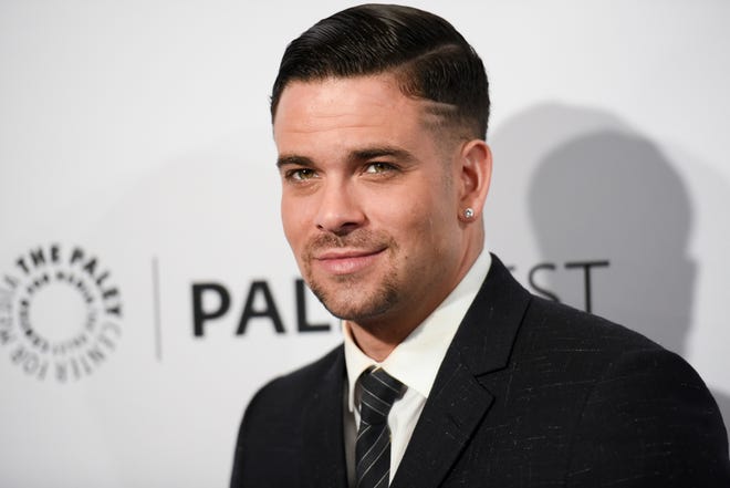 FILE - In this March 13, 2015 file photo, Mark Salling arrives at the 32nd Annual Paleyfest "Glee" held at The Dolby Theatre in Los Angeles. Salling, who played bad-boy Noah "Puck" Puckerman on the Fox musical dramedy "Glee," was charged Friday, May 27, 2016, with receiving and possessing child pornography. The 33-year-old actor was charged with two counts, according to the U.S. Attorney's Office. (Photo by Richard Shotwell/Invision/AP, File)