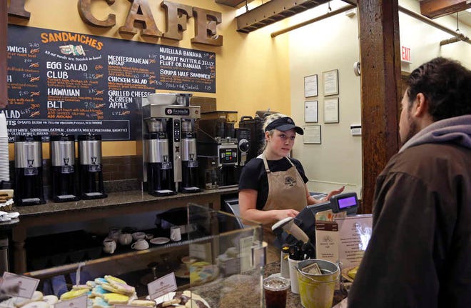 Kayla Mitchell serves a customer at Good Day Cafe in North Andover, Mass. On Friday, May 27, 2016, the Commerce Department issues the second of three estimates of how the U.S. economy performed in the January-March quarter.