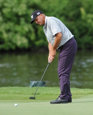 Rocco Mediate putts on the 18th hole during the third round of the Senior PGA Championship golf tournament Saturday, May 28, 2016, at Harbor Shores in Benton Harbor, Mich. (Don Campbell/The Herald-Palladium via AP)