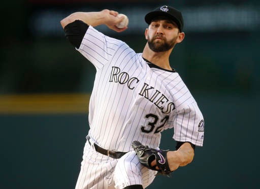Colorado Rockies starting pitcher Tyler Chatwood works against the San Francisco Giants in the first inning of a baseball game Friday, May 27, 2016, in Denver. (AP Photo/David Zalubowski)