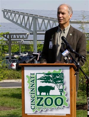 File-This May 9, 2011, file photo shows Thane Maynard, executive director of The Cincinnati Zoo, speaking at a dedication ceremony for the zoo's solar canopy parking lot cover. The Cincinnati Zoo's director says zoo security officers killed a 17-year-old gorilla that had grabbed a small boy who fell into the gorilla exhibit moat. Director Maynard says the 3-year-old boy is expected to recover after being picked up and dragged by the gorilla Saturday, May 28, 2016, for about 10 minutes. He was taken to Cincinnati Children's Hospital Medical Center. (AP Photo/Al Behrman, File)