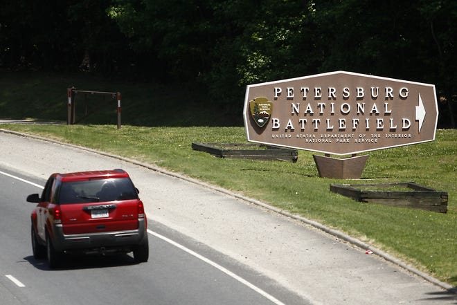 A vehicle passes the entrance Petersburg National Battlefield on Route 36 in Petersburg on Saturday, May 28, 2016. Park archaeologists and other investigators were at an undisclosed section of the park to investigate a large amount of holes where suspected looters dug for historic relics. A maintenance worker discovered the disturbed site earlier last week. Scott P. Yates/progress-index.com