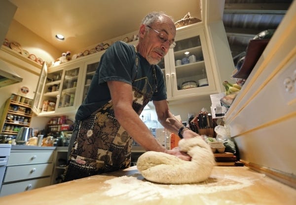 David Kessler kneads the dough for his bread that he makes for sandwiches on Tuesday, May 10, 2016. Kessler has been baking dozens of loaves a week to make hundreds of sandwiches for staff and students at the UC Berkeley Hearst Pool for the past 40 years. (Laura A. Oda/Bay Area News Group/TNS)