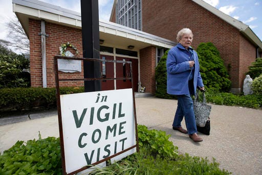 Margaret O'Brien, a parishioner at the church of St. Frances X. Cabrini, departs the church Monday, May 16, 2016, in Scituate, Mass. The Supreme Court has refused to hear an appeal from parishioners who are occupying the church, which the Roman Catholic Archdiocese of Boston closed more than a decade ago. (AP Photo/Steven Senne)