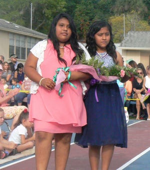 Gidcel Andres and Cecilia Amates-Torres are part of the fifth-grade processional during the A Day in May celebration.