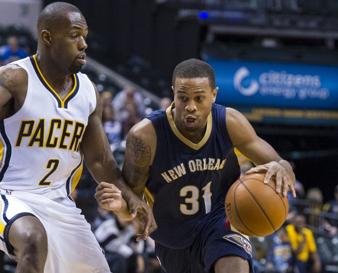 In this Oct. 3, 2015, file photo, New Orleans Pelicans' Bryce Dejean-Jones (31) drives the ball around the defense of Indiana Pacers' Rodney Stuckey (2) during the first half of a preseason NBA basketball game in Indianapolis. Police say Saturday, May 28, 2016, Dejean-Jones was fatally shot after breaking down the door to a Dallas apartment. Sr. Cpl. DeMarquis Black said in a statement that officers were called early Saturday morning and found the 23-year-old player collapsed in an outdoor passageway. He was taken to a hospital where he died. (AP Photo/Doug McSchooler, File)