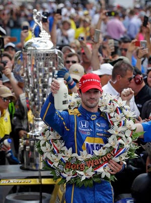 Alexander Rossi celebrates after winning the 100th running of the Indianapolis 500 auto race at Indianapolis Motor Speedway in Indianapolis, Sunday, May 29, 2016.