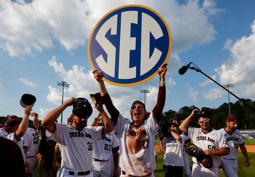 Texas A&M's players celebrate their win over Florida after the Southeastern Conference NCAA college baseball championship game at the Hoover Met, Sunday, May 29, 2016, in Hoover, Ala. (AP Photo/Brynn Anderson)