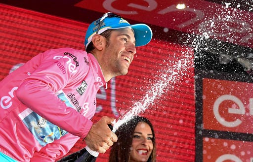 Vincenzo Nibali celebrates clinching the pink jersey of leader of the race during the 20th stage of Giro d'Italia Tour of Italy cycling race from Guillestre to Sant'Anna di Vinadio. (Alessandro Di Meo/ANSA via AP Photo) ITALY OUT