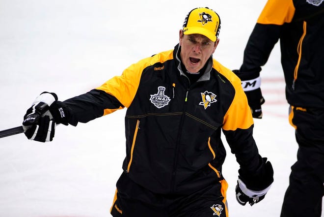 Pittsburgh Penguins head coach Mike Sullivan explains a drill during hockey practice at the Consol Energy Center in Pittsburgh, Sunday May 29, 2016. The Penguins are preparing for Game 1 of the Stanley Cup finals against the San Jose Sharks on Monday, May 30, in Pittsburgh.