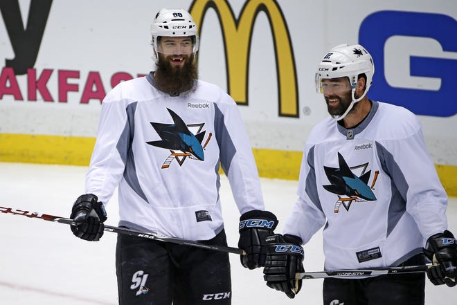 San Jose Sharks' Brent Burns, and Patrick Marleau, right, participate in a hockey practice at the Consol Energy Center in Pittsburgh, Sunday May 29, 2016. The Sharks are preparing for Game 1 of the Stanley Cup Finals against the Pittsburgh Penguins on Monday, May 30, in Pittsburgh. (AP Photo/Gene J. Puskar)