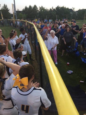 Veteran Cape Fear softball coach Doris Howard cheers this year's team after it's 1-0 win over Greenville Conley for the 4-A East Regional title and a berth in the state finals.
