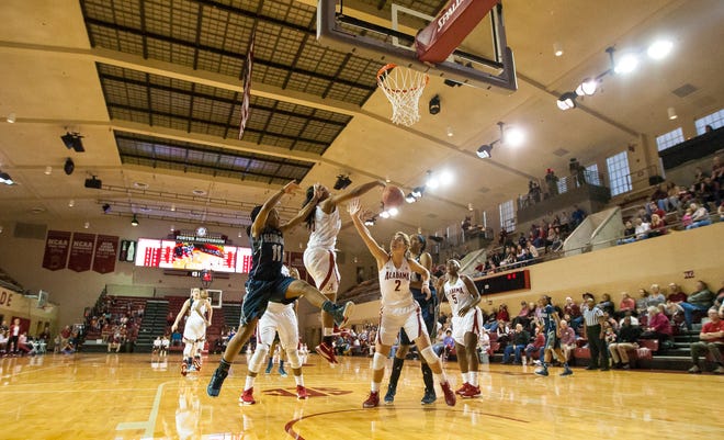 Alabama guard Meoshonti Knight (15) blocks a shot by Georgetown guard Dionna White (11) during the University of Alabama women's basketball game versus Georgetown on Dec. 12, 2015, at Foster Auditorium in Tuscaloosa. The Crimson Tide won, 78-66, over the Hoyas.