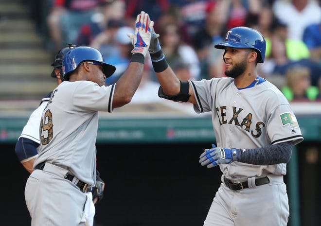 Texas Rangers' Nomar Mazara (right) celebrates with Adrian Beltre after hitting a three run home run off Cleveland Indians relief pitcher Austin Adams during the fourth inning Monday in Cleveland. . (AP Photo/Ron Schwane)