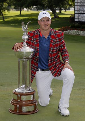 Jordan Spieth poses with the trophy after winning the Dean & DeLuca Invitational golf tournament at Colonial on Sunday in Fort Worth, Texas. Tony Gutierrez/Associated Press