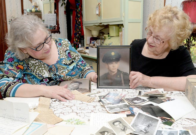 Patty Begue and Carolyn Border remember Begue's uncle and Border's brother-in-law Army Pvt. William Border. Border, of Tuscarawas County, died in April 1966 during the Vietnam conflict. 

(GateHouse Ohio / Michael Balash)