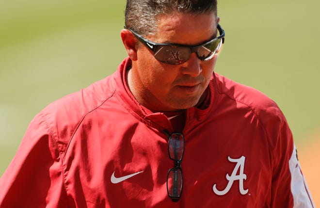 Alabama coach Mitch Gaspard walks back to the dugout between innings in the SEC Tournament at the Hoover Met, May 26, 2016. Alabama was eliminated by the Gators by a 5-4 score. Staff Photo/Gary Cosby Jr.