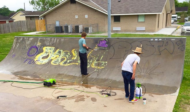 Last month parish residents Devan Landry (left), Josh Dowiatt and friends used power sprayers and graffiti removal cleaner to clean up the Ascension Parish Recreation Department Skate Park in Gonzales.