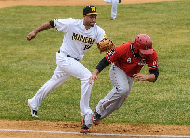 Photo by Warren Westura/New Jersey Herald - Miner thirdbaseman Michael Antonio (20) tags out Aigles runner Eric Grabe (8) on a failed steal of home at the Trois Rivers-Miners game at Skylands Park in Frankford, May 30, 2016.