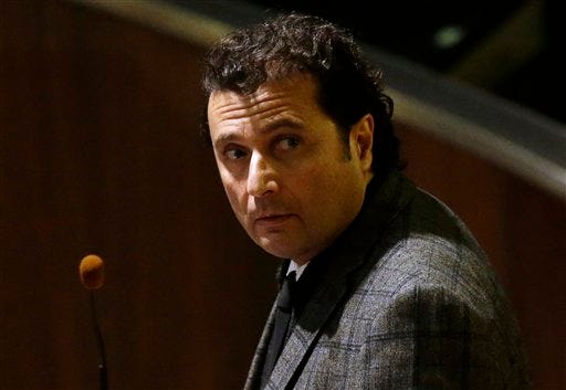 FILE - In this, Wednesday, Feb. 11, 2015 file photo, Francesco Schettino attends his trial at the Grosseto court, Italy. The captain of the capsized Costa Concordia luxury liner has been convicted of multiple charges of manslaughter and sentenced to 16 years in jail. (AP Photo/Gregorio Borgia, File)