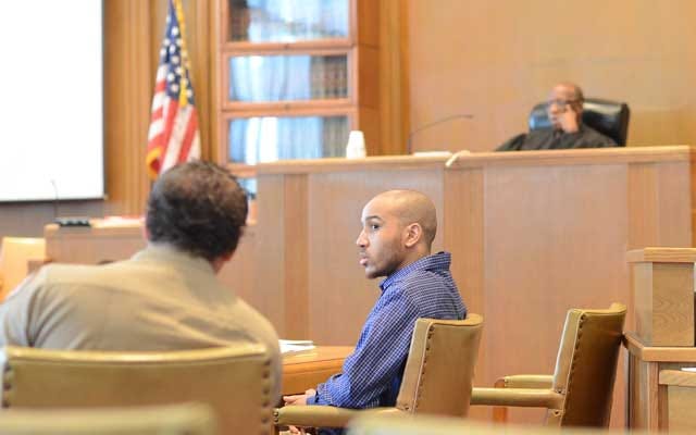 Kion Tyearl Dail looks across the courtroom Tuesday during jury selection for the trial he faces regarding the June 2011 homicide of House of Wang dishwasher Thomas Hinton.