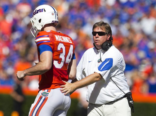 Florida Gators head coach Jim McElwain fires up the team before first half action as the Gators take on Vanderbilt for homecoming in Ben Hill Griffin Stadium on Nov. 7, 2015