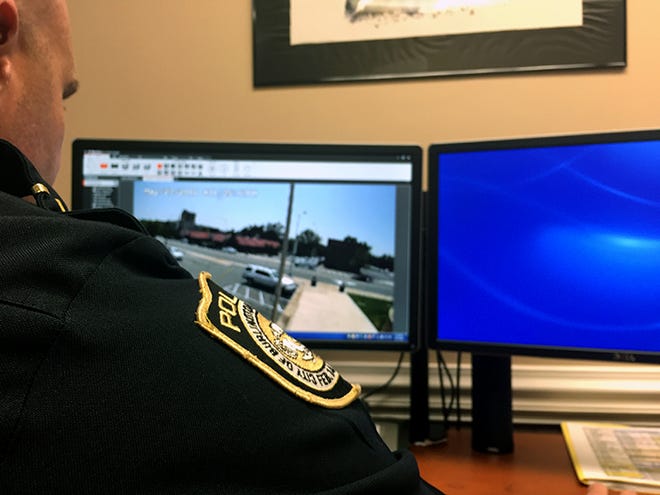 Capt. Mark Rascoe views live surveillance footage of an area of the Burlington Police Department's parking lot now designated as a "transaction zone." The public is encouraged to use the area when meeting strangers to buy and sell items off Craigslist, Facebook and other sites.