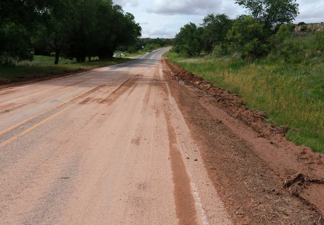 FM 835 south of FM 6900 remained closed Thurday due to high water from Wednesday's storms. The silt that accumulated has been graded off to the side of the road.