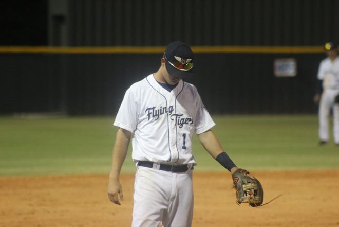 Flying Tigers shortstop A.J. Simcox hangs his head after a throwing error in the ninth inning of the Flying Tigers' 7-3 loss to the Brevard County Manatees Thursday night at Henley Field.
