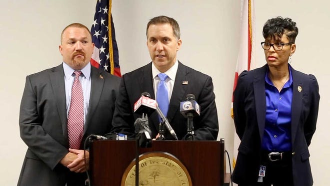 Palm Beach County State Attorney Dave Aronberg speaks during a news conference as chief assistants Brian Fernandes and Adrienne Ellis listen in West Palm Beach, Fla., Wednesday, June 1, 2016. Fired officer Nouman Raja was arrested and charged with attempted murder and manslaughter in the Oct. 18, 2015, death of Corey Jones, 31, after a grand jury found the shooting was unjustified, Aronberg said at the news conference. (Allen Eyestone/Palm Beach Post via AP) MAGS OUT; TV OUT; NO SALES; MANDATORY CREDIT