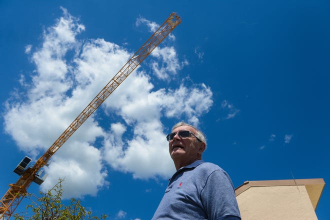 Lottie Varano, president of the Essex House Association board of directors, says the residents are tired of having a crane swinging over their condominium. The crane is used for the construction of Echelon on Palm on the adjacent lot. STAFF PHOTO / DAN WAGNER