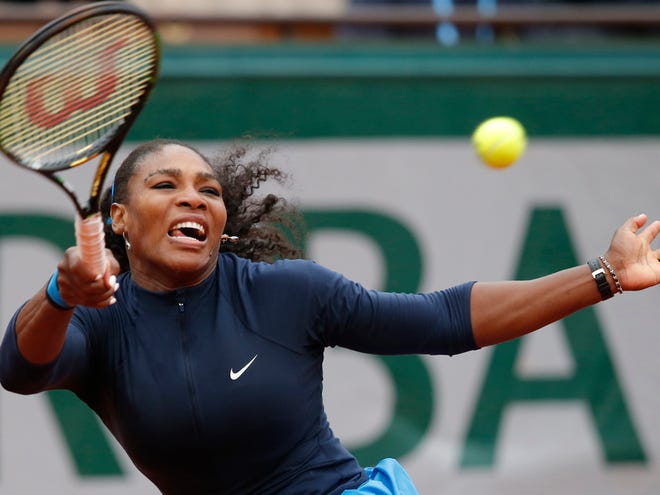 Serena Williams of the U.S. returns the ball in the quarterfinal match of the French Open tennis tournament against Kazakhstanâ€™s Yulia Putintseva at the Roland Garros stadium in Paris, France, Thursday, June 2, 2016. (AP Photo/Michel Euler)