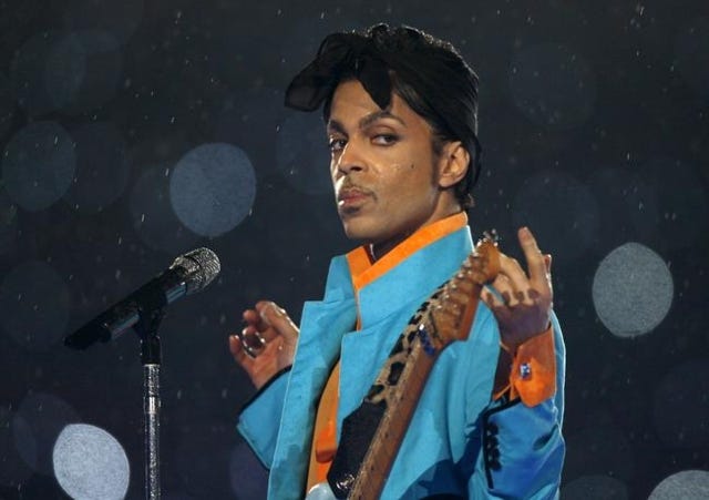 Prince performs during the halftime show of the NFL‘s Super Bowl XLI football game between the Chicago Bears and the Indianapolis Colts in Miami, Florida, U.S. February 4, 2007.   REUTERS/Mike Blake/File Photo