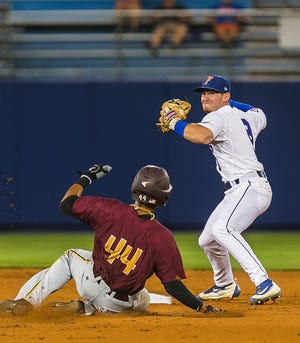 Florida's Deacon Liput forces out Bethune-Cookman's Jostenn Heron at second base Friday in Gainesville. GAINESVILLE SUN CORRESPONDENT/CYNDI CHAMBERS