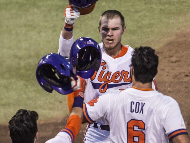 Clemson's Seth Beer celebrates with teammates after hitting a grand slam during the bottom of the third inning of Friday night's regional game against Western Carolina in Clemson.