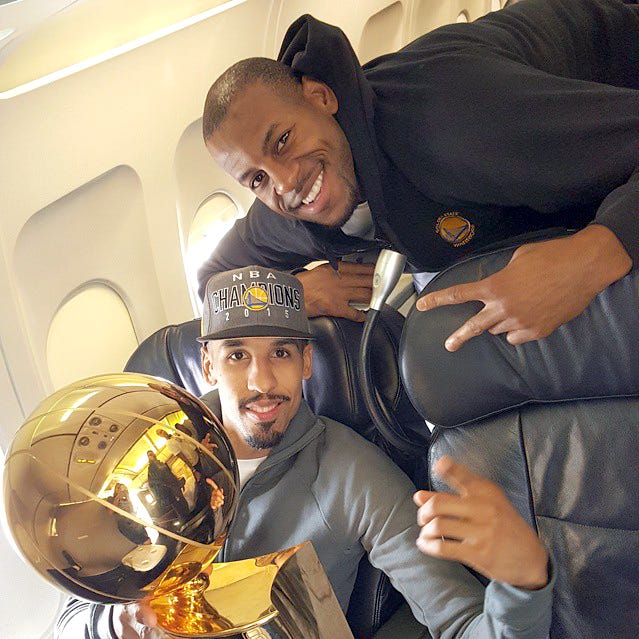 Golden State Warriors' Shaun Livingston, left, of Peoria and Andre Iguodala of Springfield pose with the NBA championship trophy in 2015.