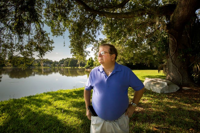 In this May 23 Ledger file photo, Barry Zimmerman looks out at Lake Horney from his backyard in Lakeland. Zimmerman is pushing to change the name of Lake Horney to Lake Lodwick.