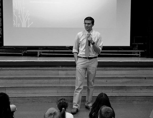 Jonathan Freeman-Coppadge, an English teacher and director of community engagement at the Groton School, speaks with Northwest Elementary School pupils, staff and parents on Thursday, May 26.