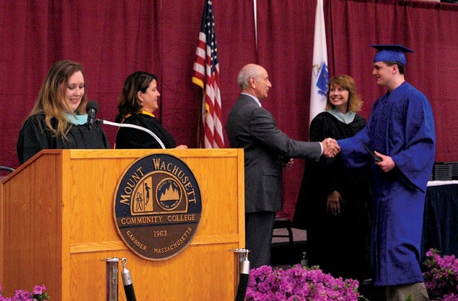 Joseph Williams of Leominster accepts congratulations from Mount Wachusett Community College President Daniel M. Asquino during the college’s dual enrollment graduation ceremony. Also pictured, from left, are Assistant Dean of K­12 Partnerships and Civic Engagement Fagan Forhan, Vice President of External Affairs, Communications and K­12 Partnerships Lea Ann Scales, and Tari Thomas, superintendent of the Ralph C. Mahar Regional High School.