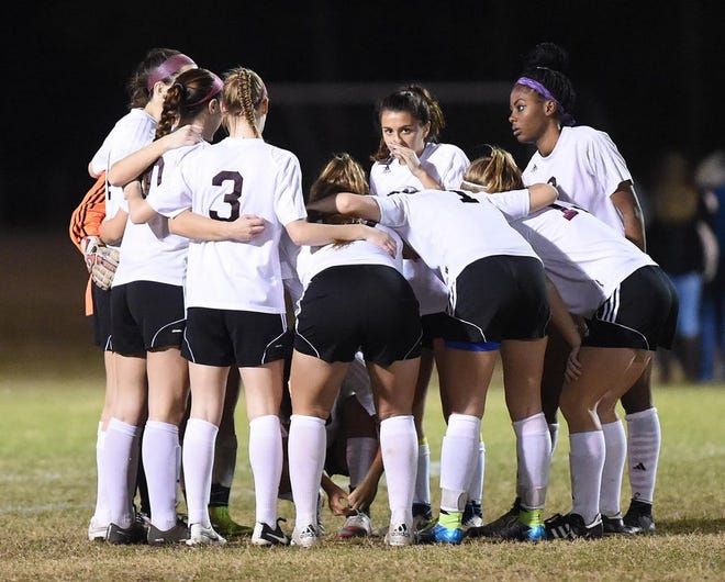 The Niceville soccer team huddles in the 3A state title game this past February.