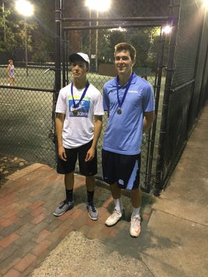 Kenji Price, left, and Marshall Parker took top men's doubles honors in the annual 'Tennis Under the Stars' tournament at the Cleveland Country Club in Shelby. SPECIAL TO THE STAR