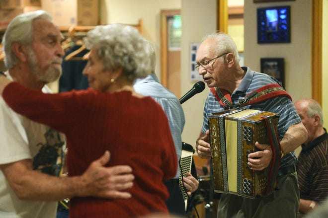 In this May 23, 2016 photo, Norm Cimino sings and plays the accordion during SNPJ Polka Jam in Strabane, Pa. The lodge hosted an appearance from a Cleveland polka band. (Celeste Van Kirk/Observer-Reporter via AP) MANDATORY CREDIT