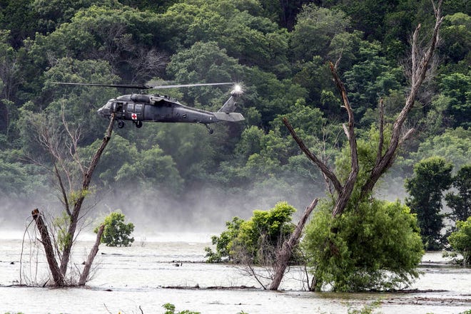 Army helicopters hover above Lake Belton Friday, June 3, 2016, searching for four missing soldiers from U.S Army's Fort Hood that were swept away in a low water crossing during training when the Army vehicle they were in was swept away on Thursday. Five soldiers were killed, four are still missing and three were rescued on Thursday.  (Rodolfo Gonzalez/Austin American-Statesman via AP)
