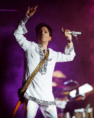 FILE - In this April 26, 2008 file photo, Prince performs during the second day of the Coachella Valley Music and Arts Festival in Indio, Calif. A law-enforcement official says that tests show the music superstar died of an opioid overdose. Prince was found dead at his home on April 21, 2016, in suburban Minneapolis. He was 57. (AP Photo/Chris Pizzello, File)