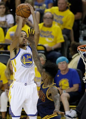 Golden State Warriors guard Shaun Livingston (34) shoots against Cleveland Cavaliers guard Iman Shumpert during the first half of Game 1 of basketball's NBA Finals in Oakland, Calif., Thursday, June 2, 2016. The Warriors won 104-89. (AP Photo/Marcio Jose Sanchez)